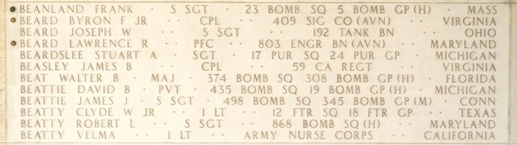A rosette next to the name of Cpl. Byron F. Beard Jr. on the Walls of the Missing at Manila American Cemetery signifies he has been identified. (ABMC photo)