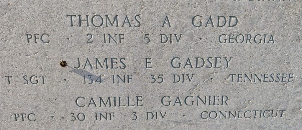 A rosette next to the name of Tech. Sgt. James E. Gadsey on the Walls of the Missing at Lorraine American Cemetery signifies he has been identified. (ABMC photo)