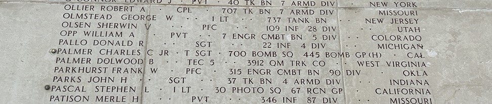 A rosette next to the name of Tech Sgt. Charles C. Palmer Jr. on the Walls of the Missing at Luxembourg American Cemetery signifies he has been identified. (ABMC photo)