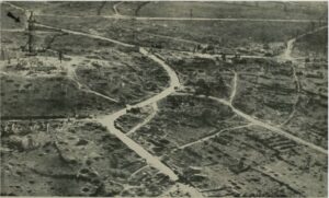 Airplane photograph of Montfaucon looking South. Arrow indicates sketched-in-position of Meuse-Argonne American Memorial.
