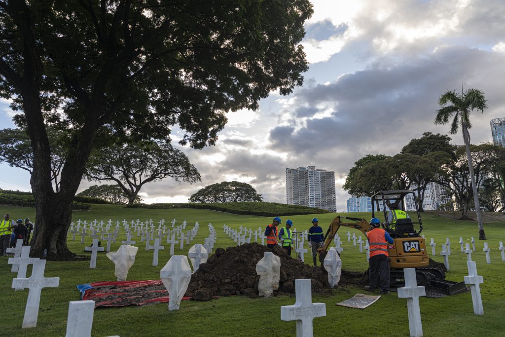 As the sun sets, a team at Manila American Cemetery works to disinter the remains of an unknown service member. The remains will be processed by the Defense POW/MIA Accounting Agency to see if they can be identified. Since the first disinterment at an ABMC site in 2004, almost 1,200 have been completed.