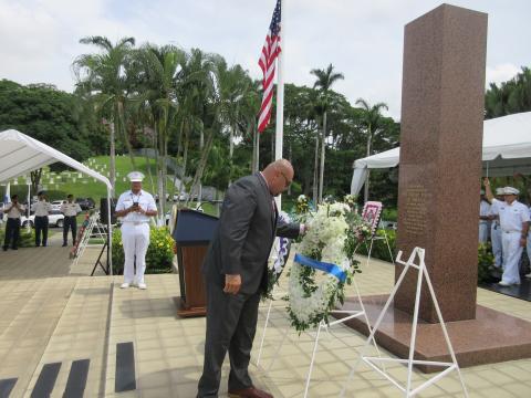 Villalobos pauses to reflect after laying the wreath.