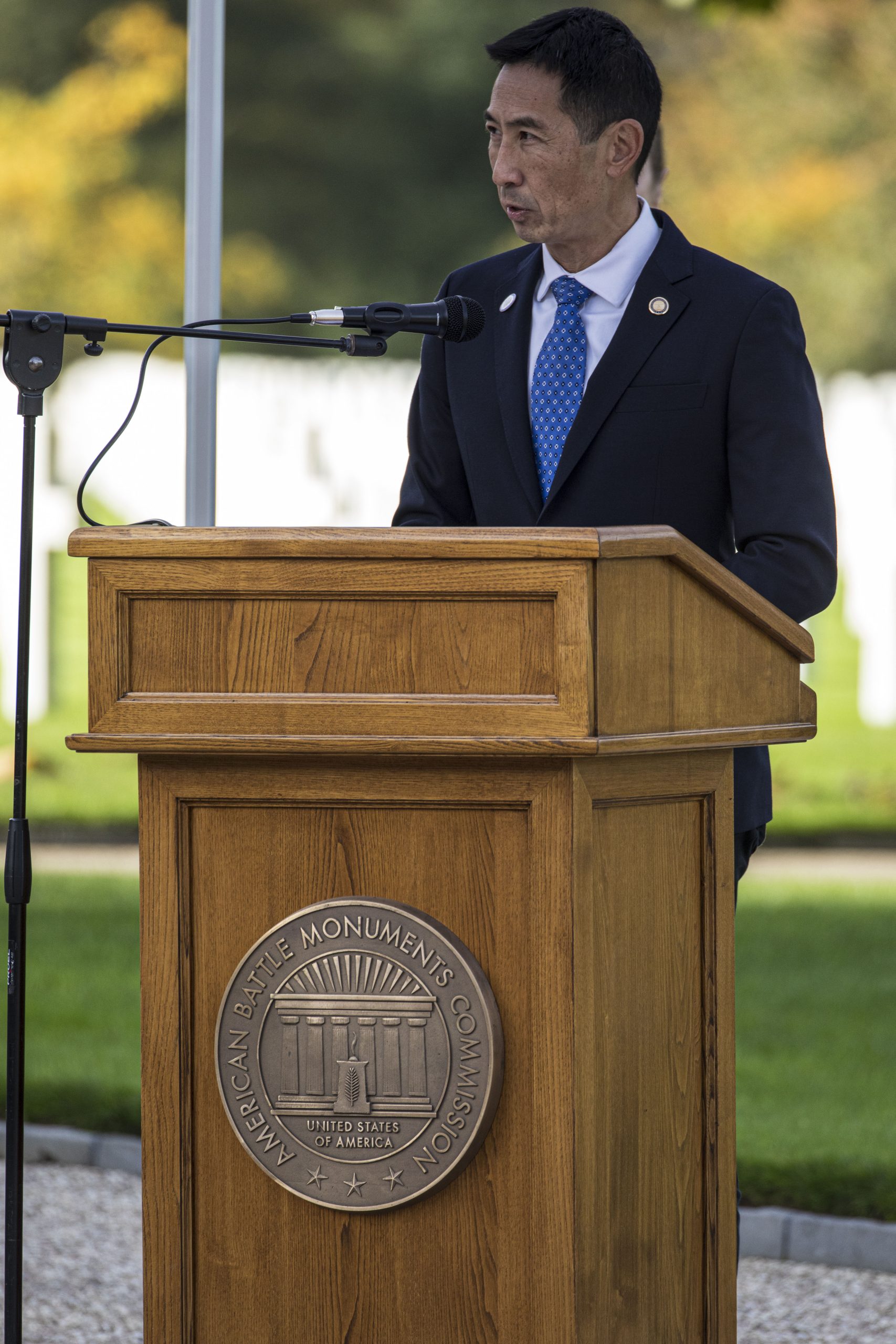 Picture of ABMC Secretary Charles K. Djou delivering remarks at Epinal American Cemetery on Oct. 19, 2024. Credits: American Battle Monuments Commission.