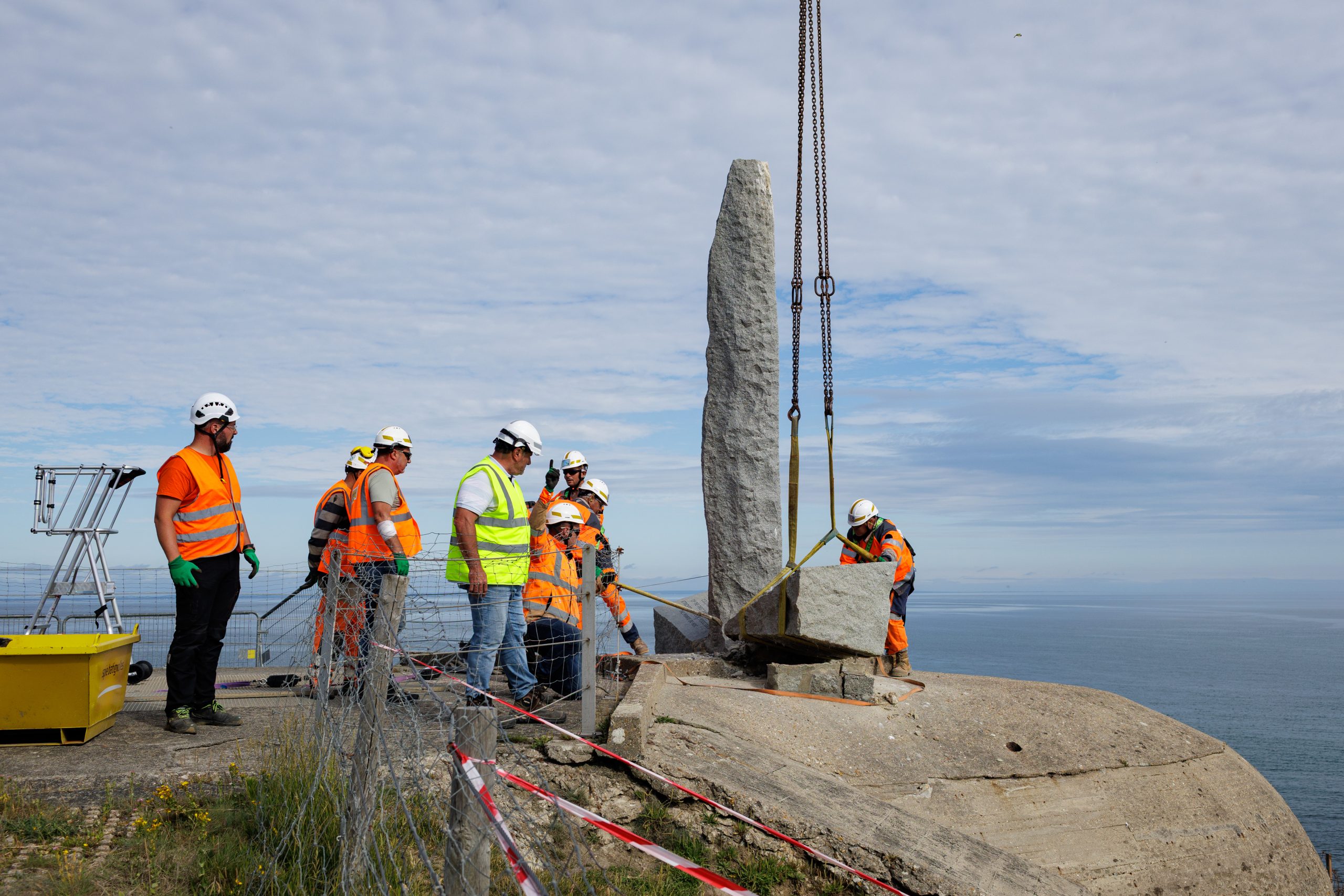 The two lateral elements or “books” of the Pointe du Hoc Ranger Monument being removed from the dagger. Credit: American Battle Monuments Commission.