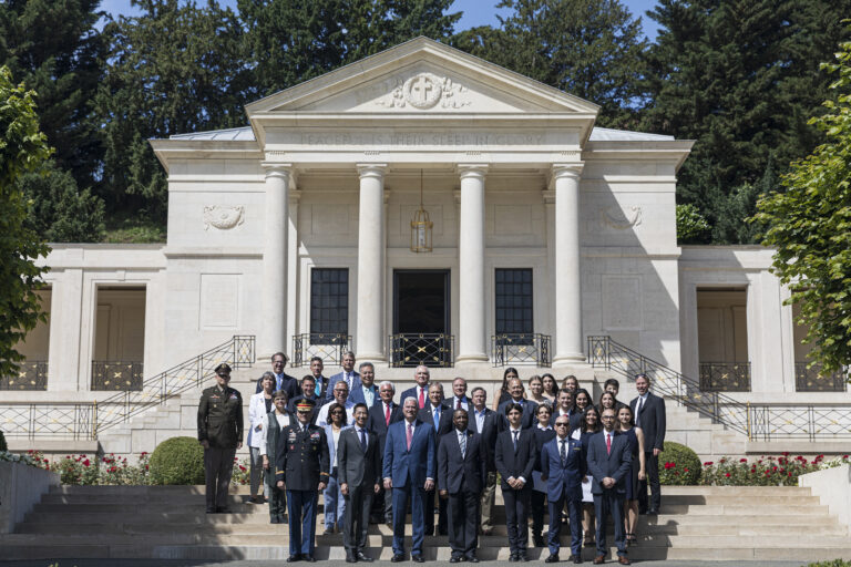 U.S. Members of Congress and students from the American School of Paris attend a wreath ceremony at the Suresnes American Cemetery and Memorial during a recent visit. Students from the school gave interpretative stories on individuals buried at the cemetery.