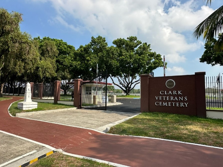 Picture of the entrance of Clark Veterans Cemetery in the Philippines. Credit: American Battle Monuments Commission.
