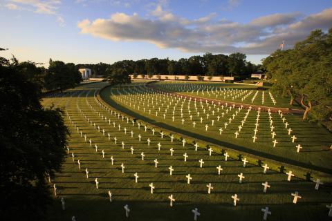 Early morning sun creates shadows for the rows of headstones at Cambridge American Cemetery