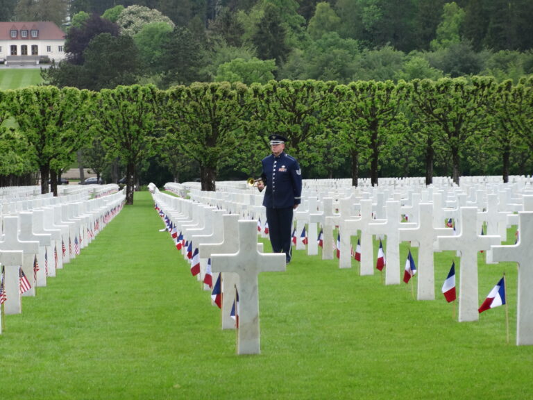 A bugler stands amidst the headstones during the 2016 Memorial Day Ceremony at Meuse-Argonne American Cemetery.