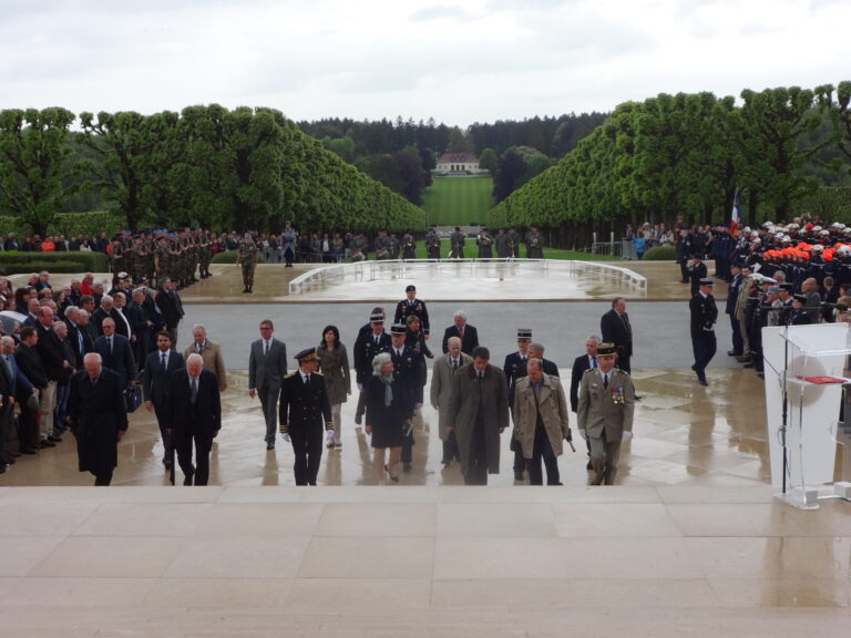 The official party walks towards the chapel building