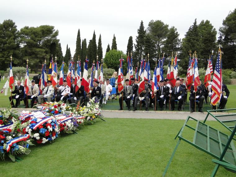French flag bearers sit during the 2014 Memorial Day Ceremony at Rhone American Cemetery in France.