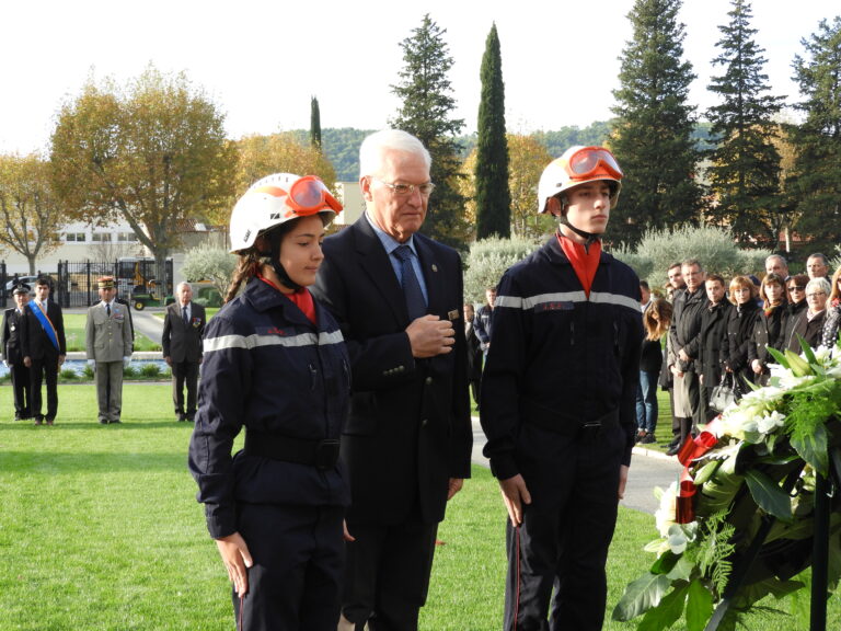 Superintendent Dwight Anderson along with two firefighters pause after laying a wreath during the 2017 Veterans Day Ceremony at Rhone American Cemetery.
