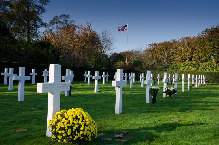 Flowers were brought to many headstones during the 2016 Veterans Day weekend at Flanders Field  American Cemetery. Image courtesy of Philippe Vanderdonckt.
