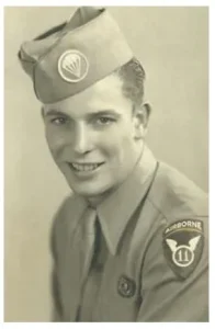 A WWII era black and white headshot of Pvt. Robert R. Gruwell in his uniform.