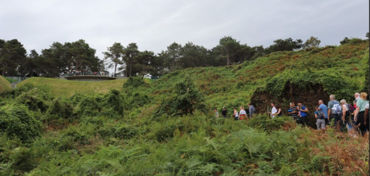 Picture of ABMC staff and visitors walking up the path going from Omaha Beach to Normandy American Cemetery for European Heritage Days. Credit: American Battle Monuments Commission.