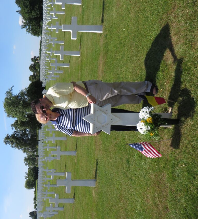 Marie-Thérèse Huppertz stands with Danial Moraglia at the headstone of his great uncle