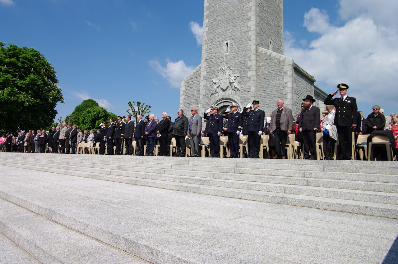 Participants and attendees stand during the 2013 Memorial Day ceremony at Brittany American Cemetery in France.