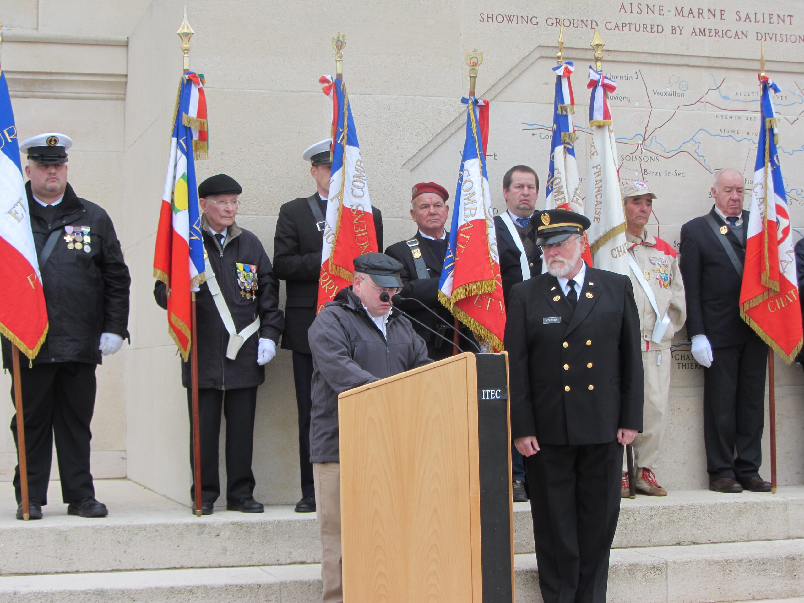 A man delivers remarks in front of the Chateau-Thierry American Monument for Veterans Day 2012.