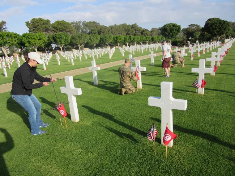 Fifteen volunteers from the U.S. Army and the U.S. Embassy in Tunis came to North Africa American Cemetery to assist staff with the flag placements.