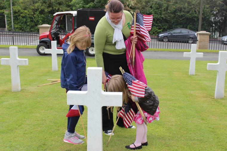 Families helped plant the American and French flag in front of every headstone at Suresnes American Cemetery in preparation for the 2015 Memorial Day Ceremony. Image courtesy of Katarina Holtzapple.