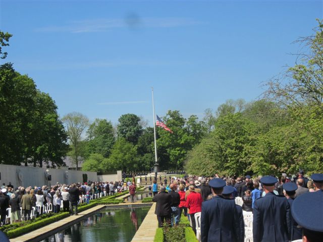 Ceremony attendees face the flag pole during the 2013 Memorial Day ceremony at Cambridge American Cemetery in England.