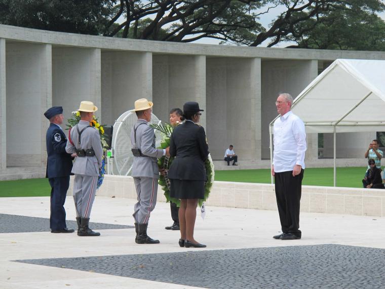 Participants present wreaths during the 2013 Veterans Day Ceremony at Manila American Cemetery in the Philippines.