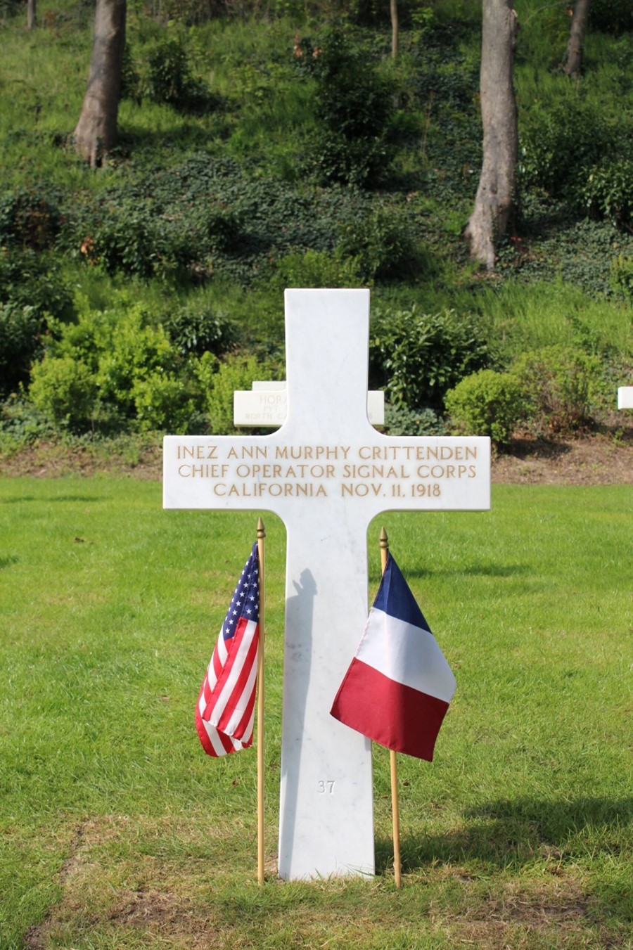 Headstone of Inez Ann Murphy Crittenden, chief operator in the Signal Corps, who rests right alongside 23 other women at Suresnes American Cemetery. Credits: American Battle Monuments Commission.