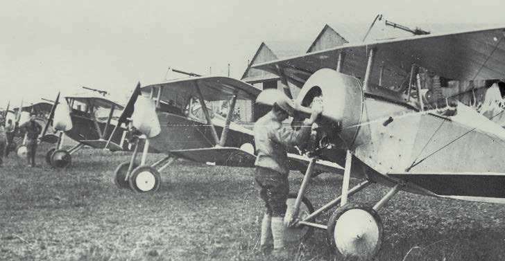 View of Lafayette Escadrille Nieuport XI fighters on the line at Luxeuil-les-Bains Aerodrome, France; circa 1916.
