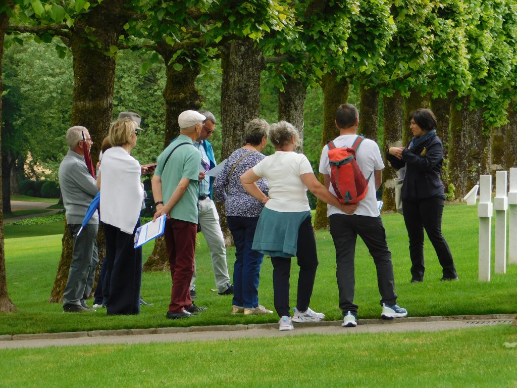 Visitors in the plots at Meuse-Argonne American Cemetery during a tour for Printemps des Cimetières 2026. Credit: American Battle Monuments Commission.