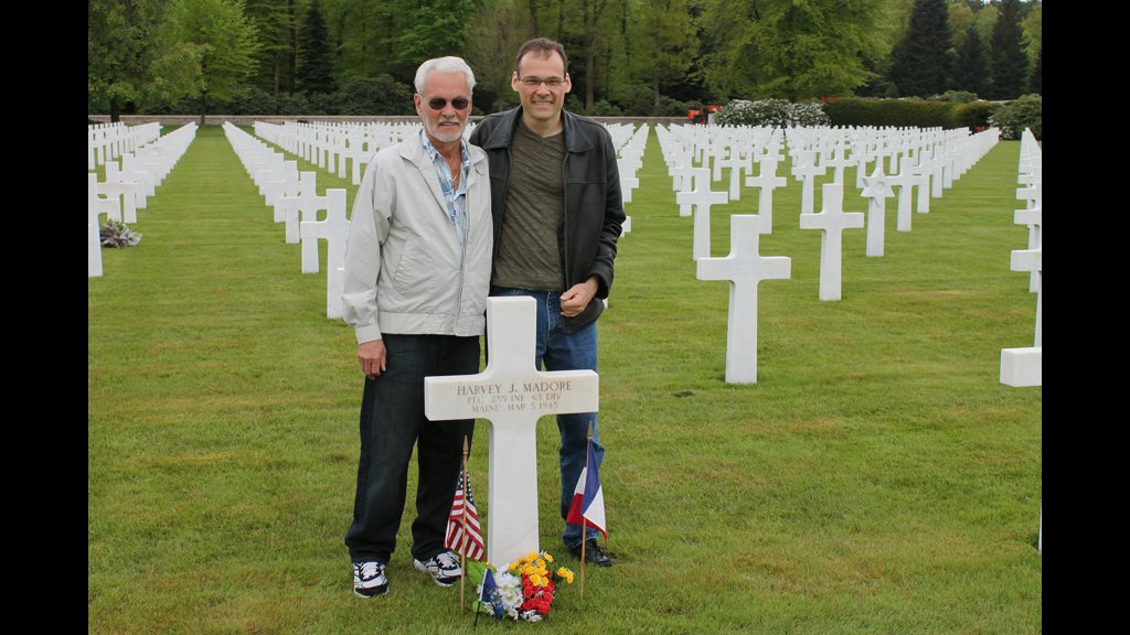 Robert and Roger Madore (son and grandson of Harvey) visit his grave, 2013. Courtesy of Robert Madore.