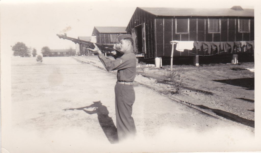 Madore aiming his rifle at Camp Van Dorn in Centreville, Mississippi, 1944. Courtesy of Robert Madore.