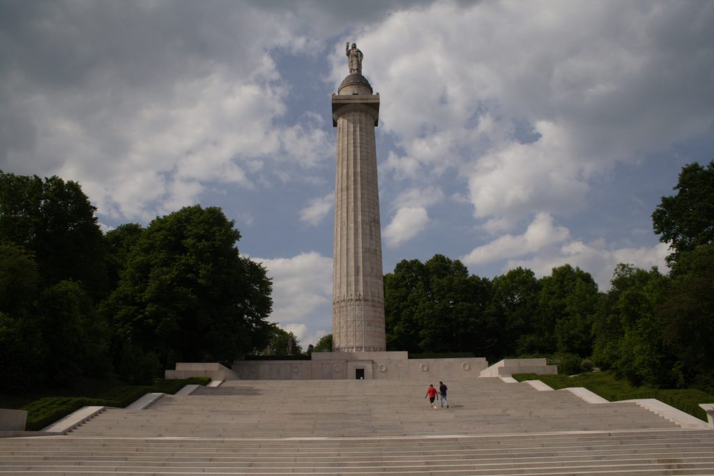 Montfaucon American Monument with the steps in front of it and clouds in the sky. Credit: American Battle Monuments Commission/Robert Uth.
