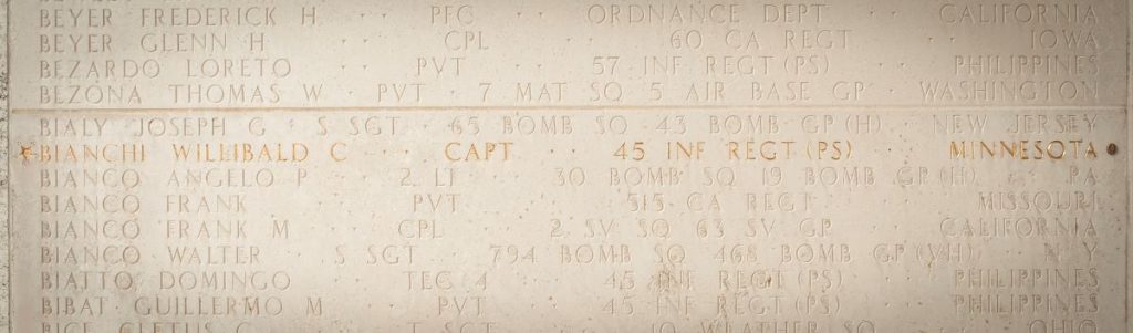 A bronze rosette next to the name of Capt. Willibald Bianchi on the Walls of the Missing signifies he has been accounted for. The Medal of Honor recipient's identification was announced by DPAA Sept. 19, 2025 in conjunction with POW/MIA Recognition Day. (Photo by American Battle Monuments Commission)