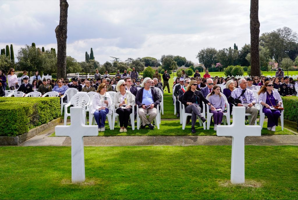Headstone of Sgt. Sylvester Antolak with his picture displayed near it at Sicily-Rome American Cemetery. Credit: American Battle Monuments Commission. 