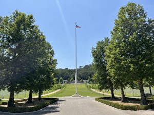 The U.S. flag traveling for the Flag Sojourn 250 flies over Florence American Cemetery in Italy.