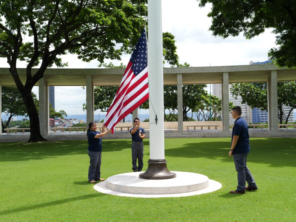 Staff raise the U.S. flag over Manila American Cemetery in the Philippines as part of Flag Sojourn 250. (American Battle Monuments Commission photo)