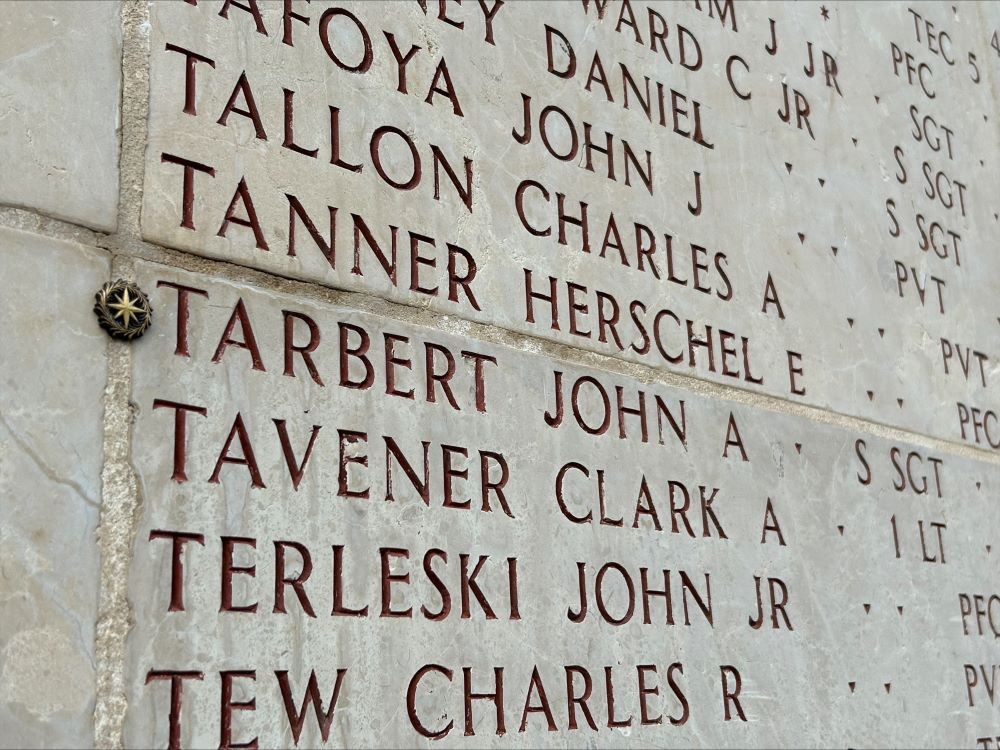 A bronze rosette is placed next to the name of John A. Tarbert on the Walls of the Missing A bronze rosette is placed next to the name of John A. Tarbert on the Walls of the Missing