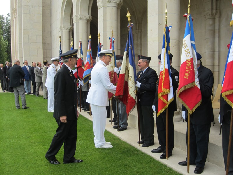 Rear Admiral Christenson greets the flag bearers during the 2014 Memorial Day Ceremony at Meuse-Argonne American Cemetery in France.