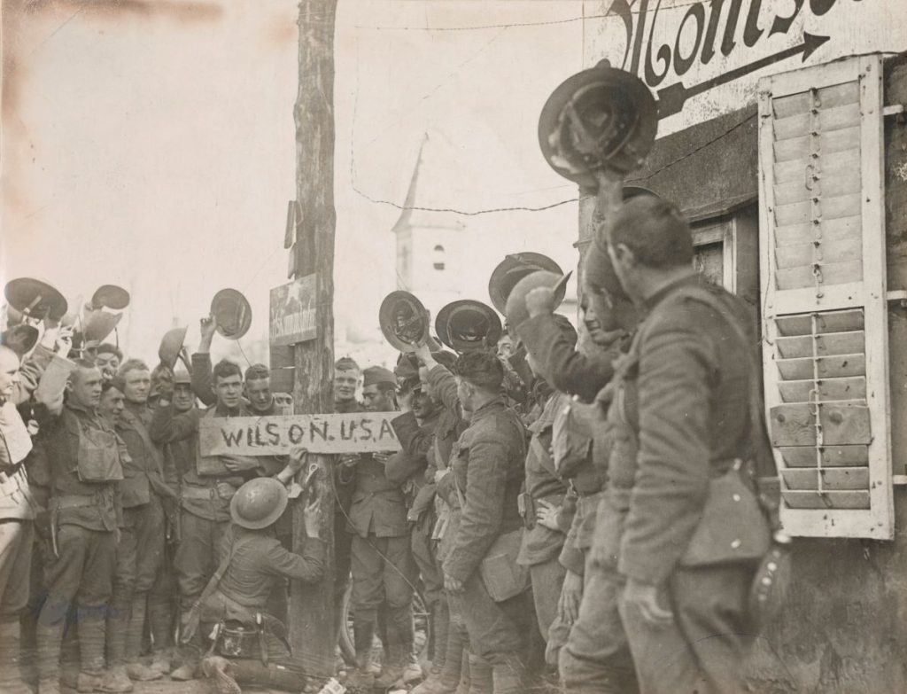 Soldiers change the name of a Vigneulles street sign from “Hindenburg Strasse” to “Wilson, U.S.A.”